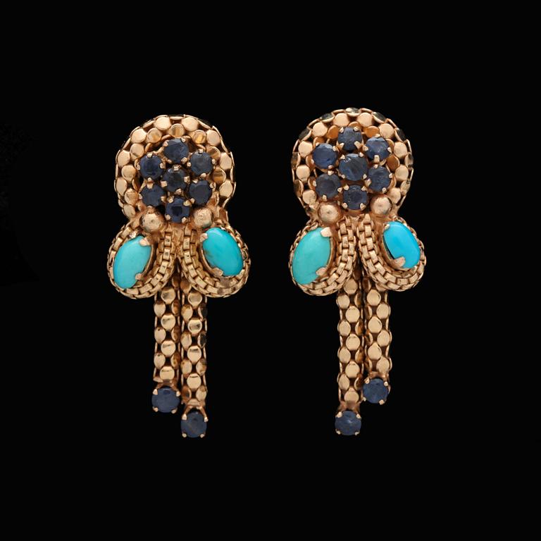 A pair of facett cut sapphire and turqouise earrings.