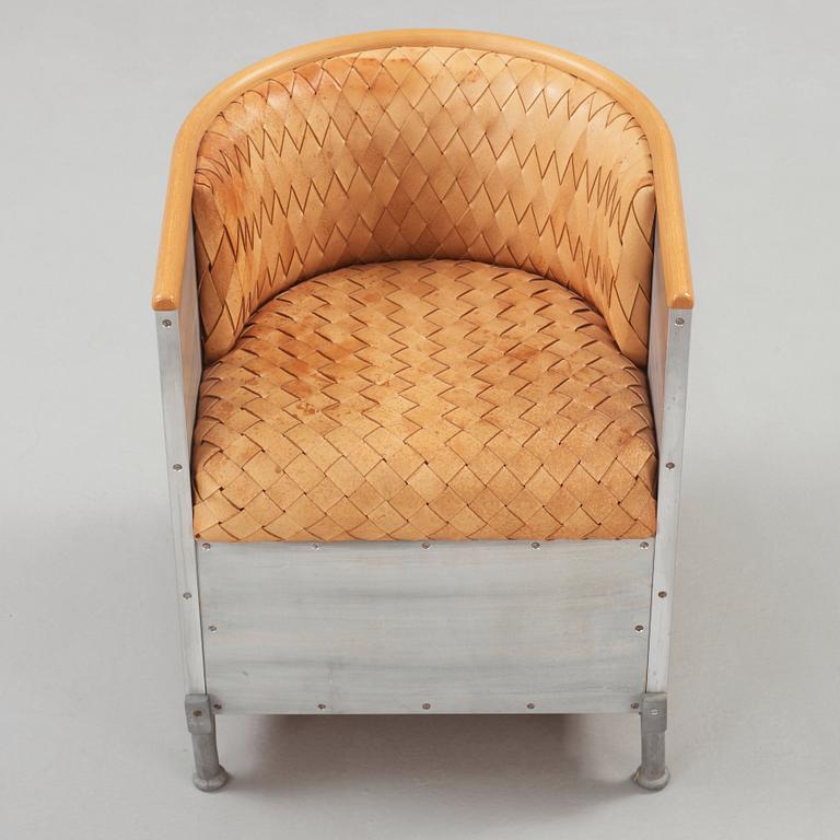 A Mats Theselius aluminium and leather armchair, Värnamo ca 1990.