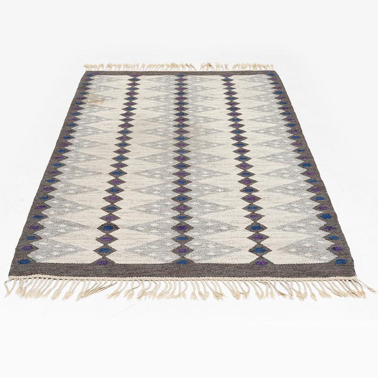 Berit Koenig,a flat weave rug, signed SH BK, c. 208 x 132 cm.