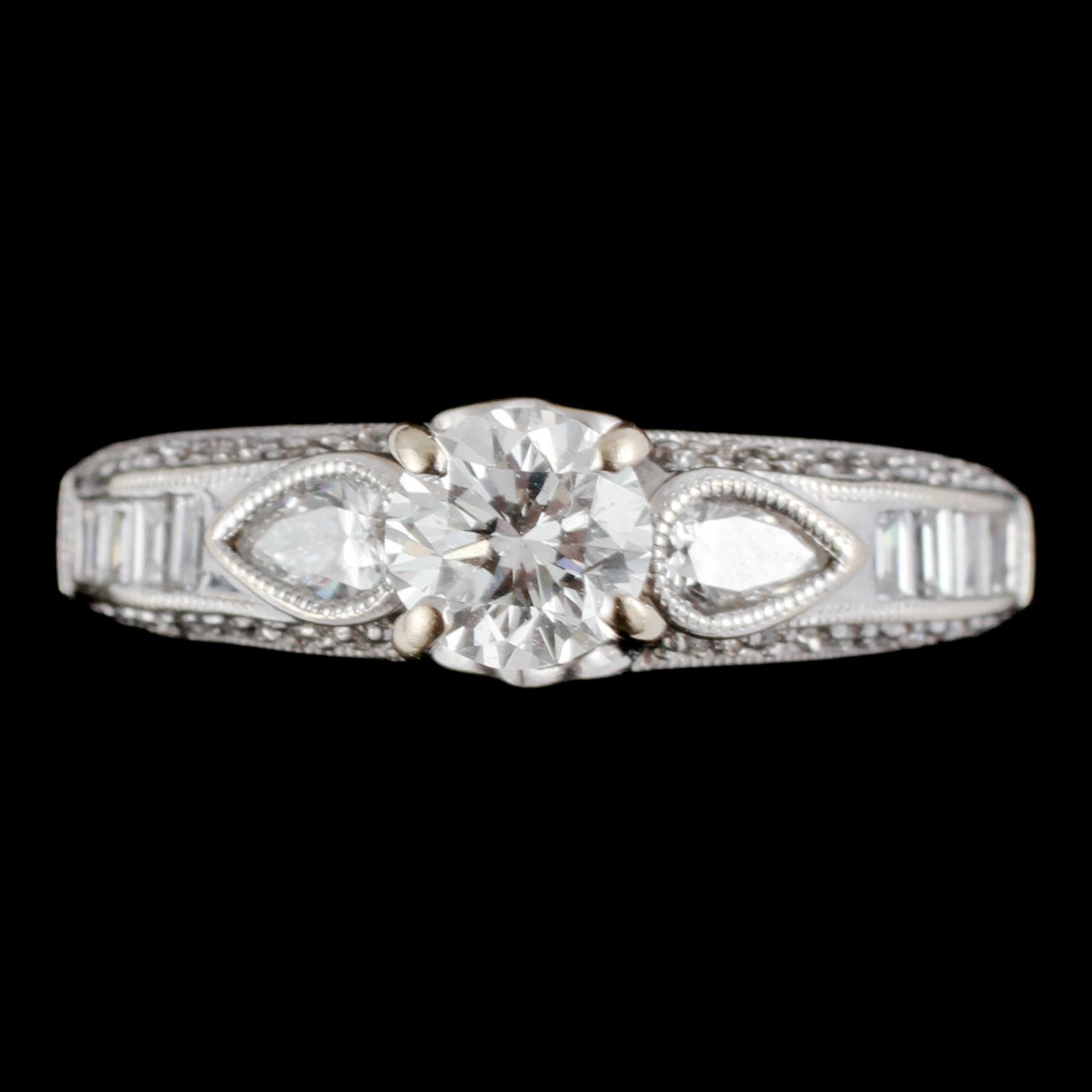 RING, 18k vitguld med briljantslipad diamant ca 0.5 ct samt 34 fasettslipade diamanter, 2000-tal. Vikt 5 g.