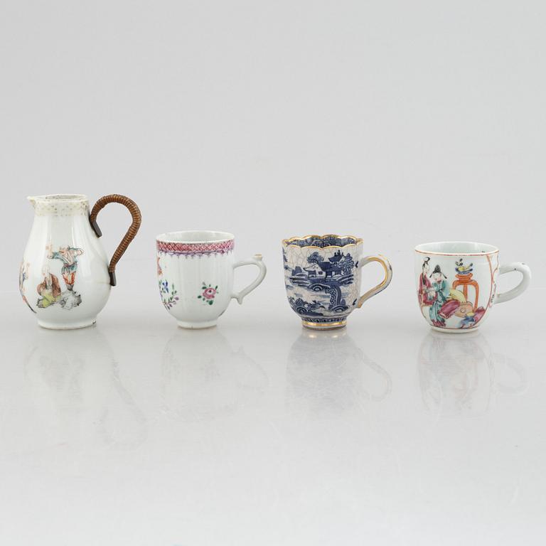A creamer, seven porcelain cups and seven saucers, China, Qing dynasty, 18th century.