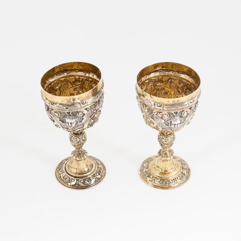 A pair of probably 19th Century parcel-gilt silver cups. Renaissance style.