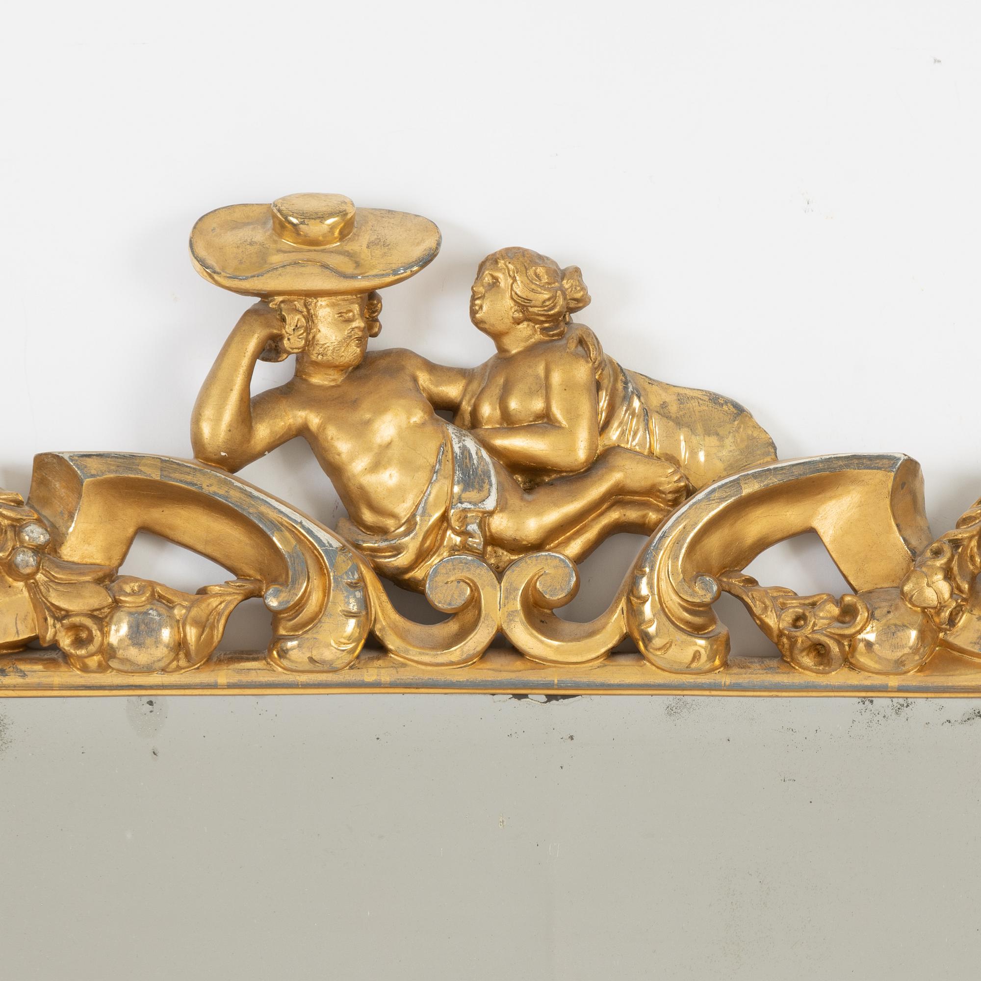 A gilt Baroque style mirror, circa 1900.