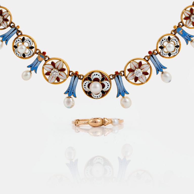 An enamel necklace and a ring in a fitted case from Giuliano.