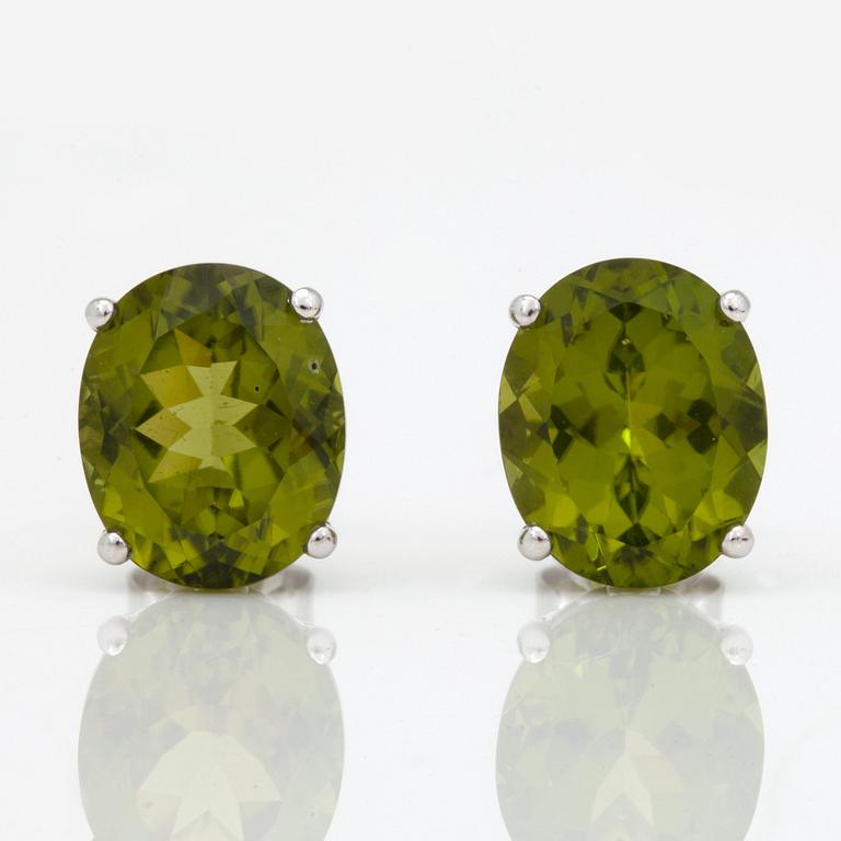 A pair of peridot and yellow cultured south sea pearl earrings.