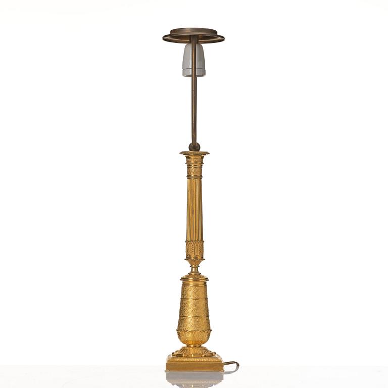 An gilded Empire table lamp.