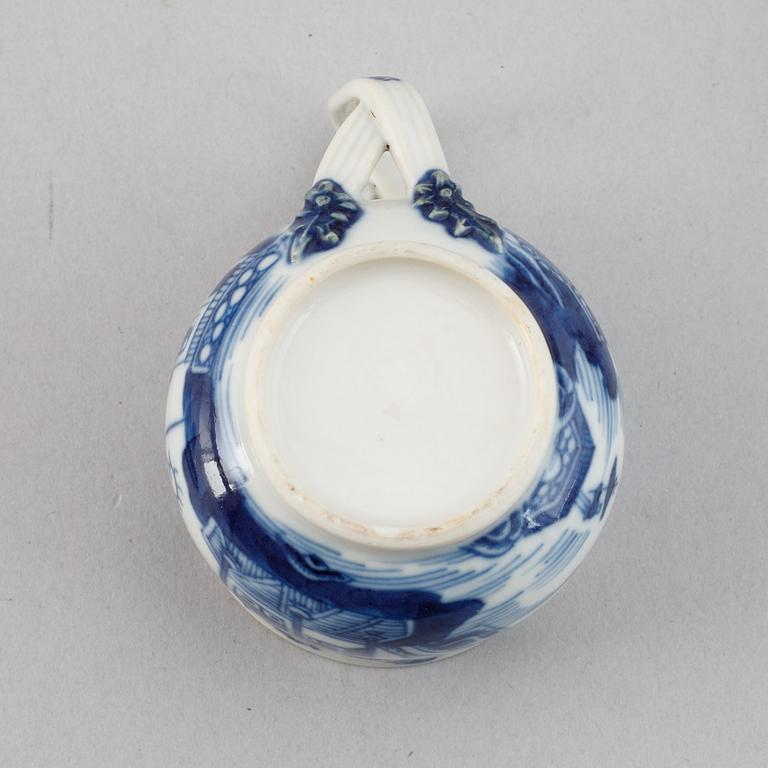 A set of six blue and white custard cups with covers,