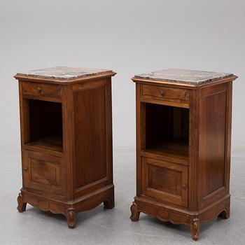 A pair of walnut marble top bedside tables, first half of the 20th Century.