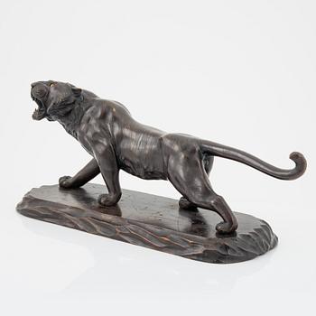 A Japanese sculpture of a tiger, 20th Century.