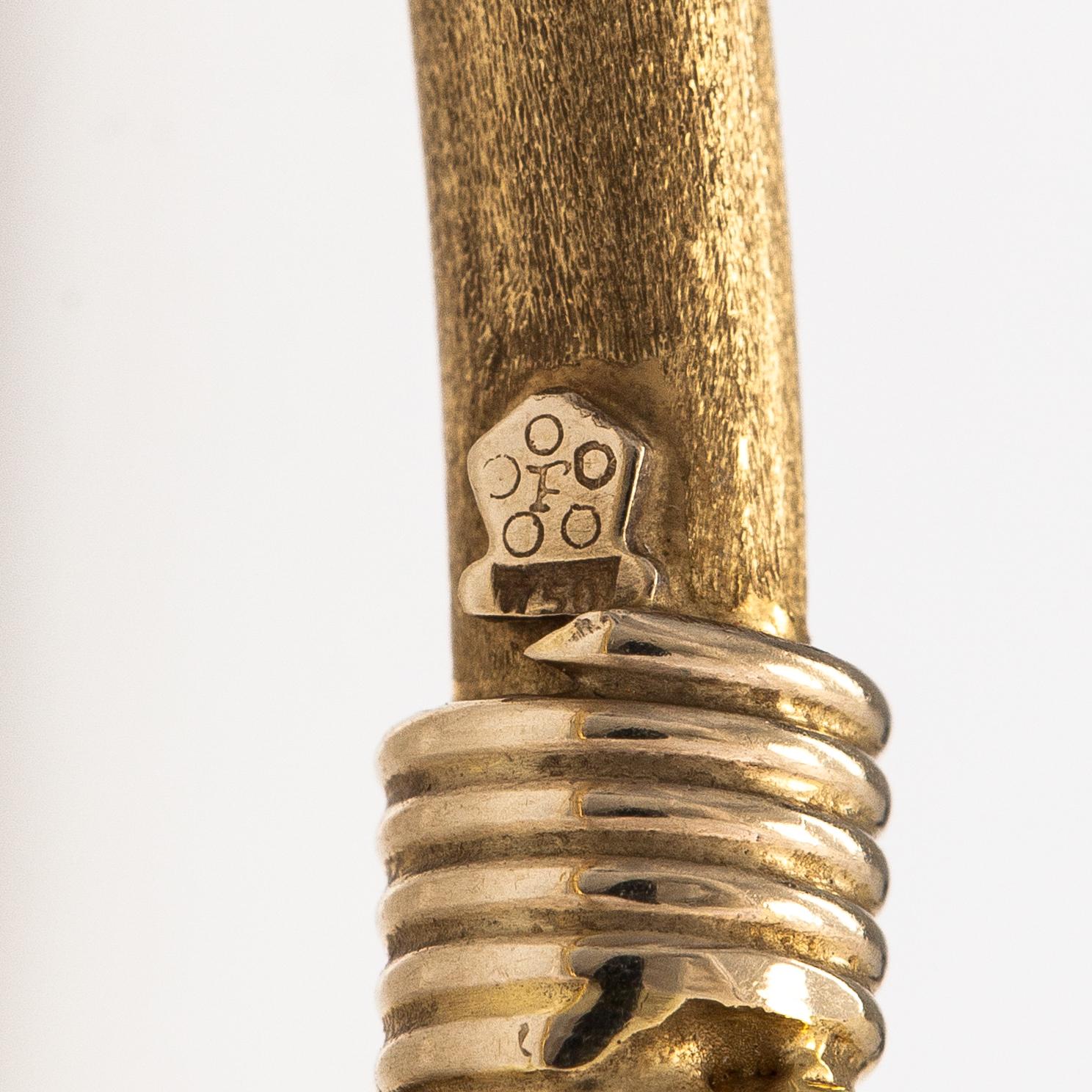 An 18K gold bracelet.