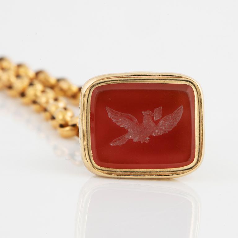 A carnelian seal in a chain.