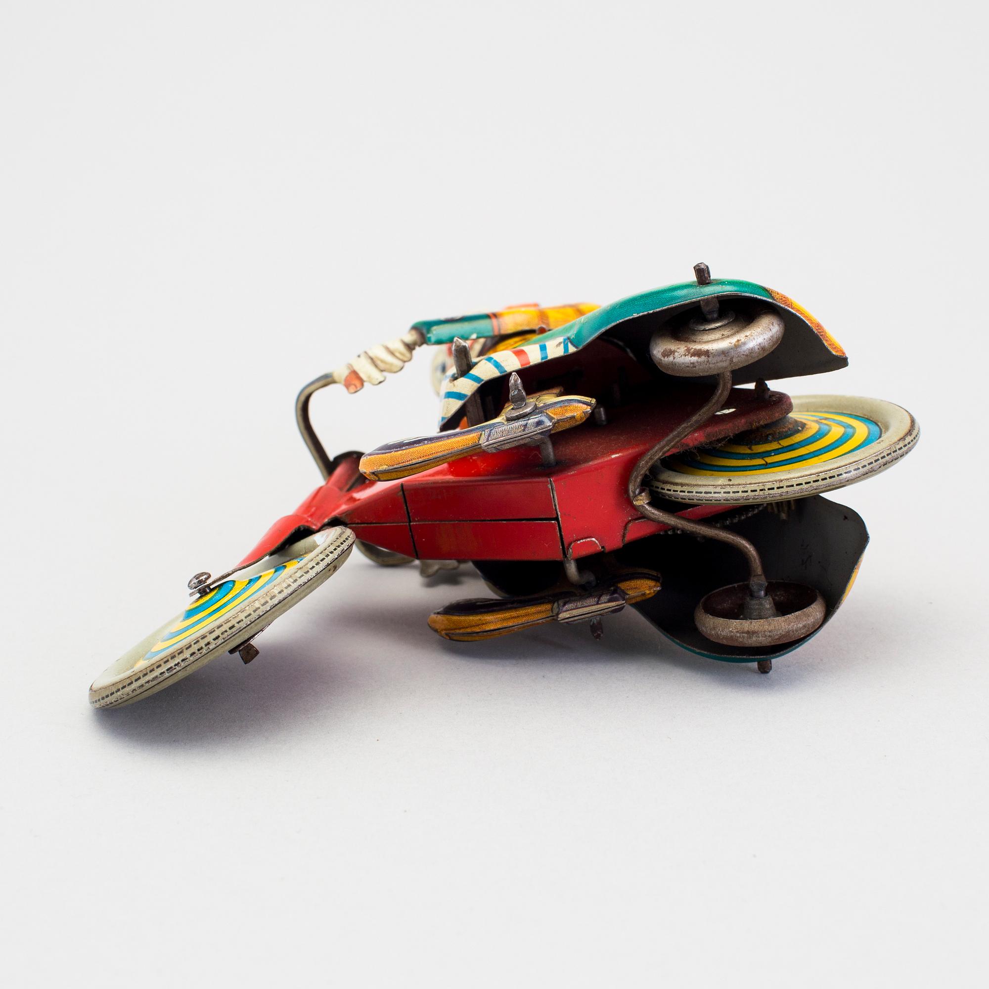 A tinplate Technofix bicycling clown Germany c. 1950.