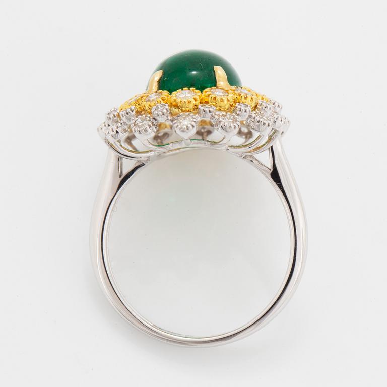 Cabochon-cut emerald and brilliant-cut diamond ring.