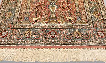 An oriental silk rug, approx. 155 x 93 cm.
