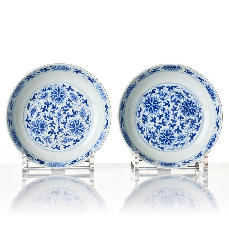 A set of four blue and white 'lotus dishes', Qing dynasty, Tongzhi mark and period (1862-1874).