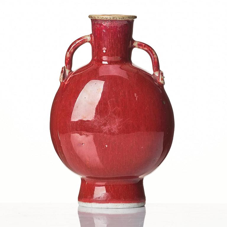 A sang de boef glazed moon flask, Qing dynasty, circa 1900.