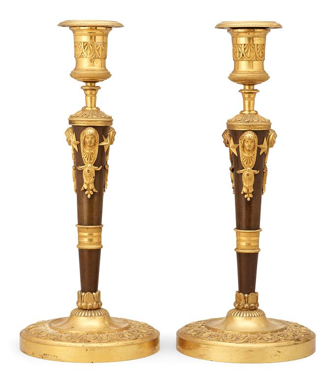 A pair of Empire early 19th century candlesticks.