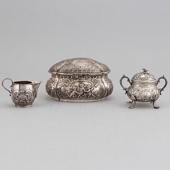 A german silver 800 sugar box, creamer and sugar bowl.