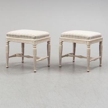 A pair of gustavian late 18th century stools by Erik Öhrmark (master in Stockholm 1777-1813).