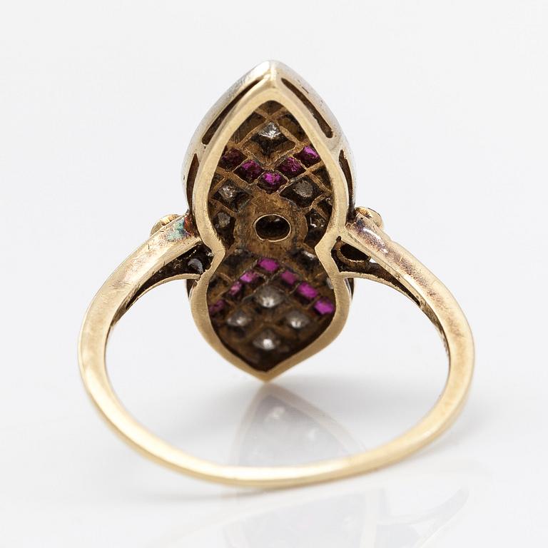 An 18K gold ring, brilliant- and single cut diamonds ca- 0.43 ct in total and rubies.