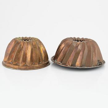Four copper cake moulds. 18th and 19th Century.