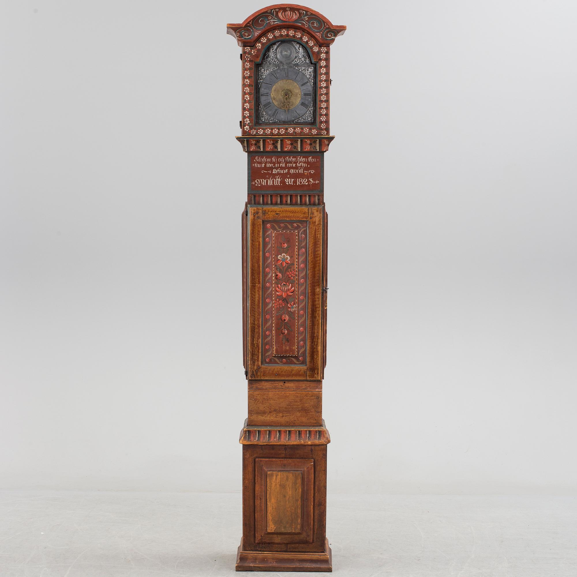 a painted grandfather-clock dated 1823.