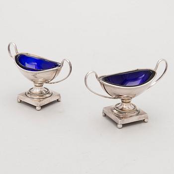 A pair of silver plated salt cellars with cobalt blue glass liners, mark of E.G. Webster & Son, New York.