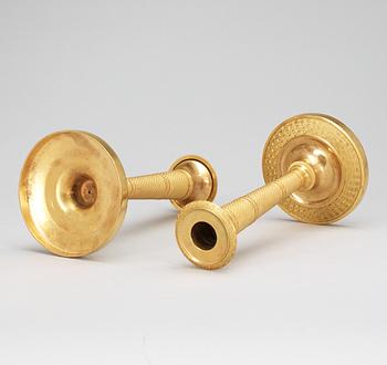 A pair of French Empire early 19th Century candlesticks.