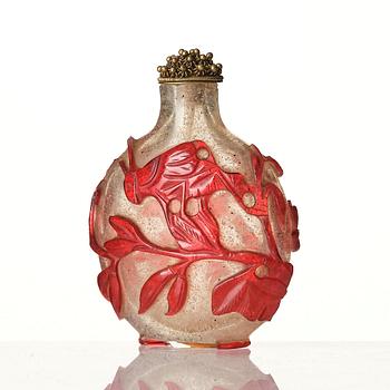 A red overlay Beijing glass snuff bottle, Qing dynasty.