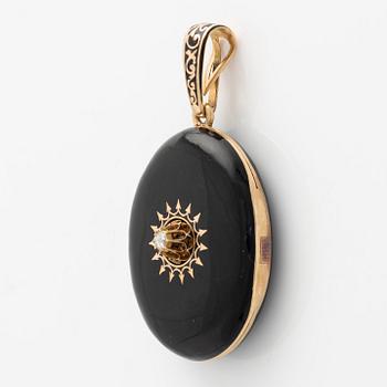 Medallion gold and black enamel with rose-cut diamond.