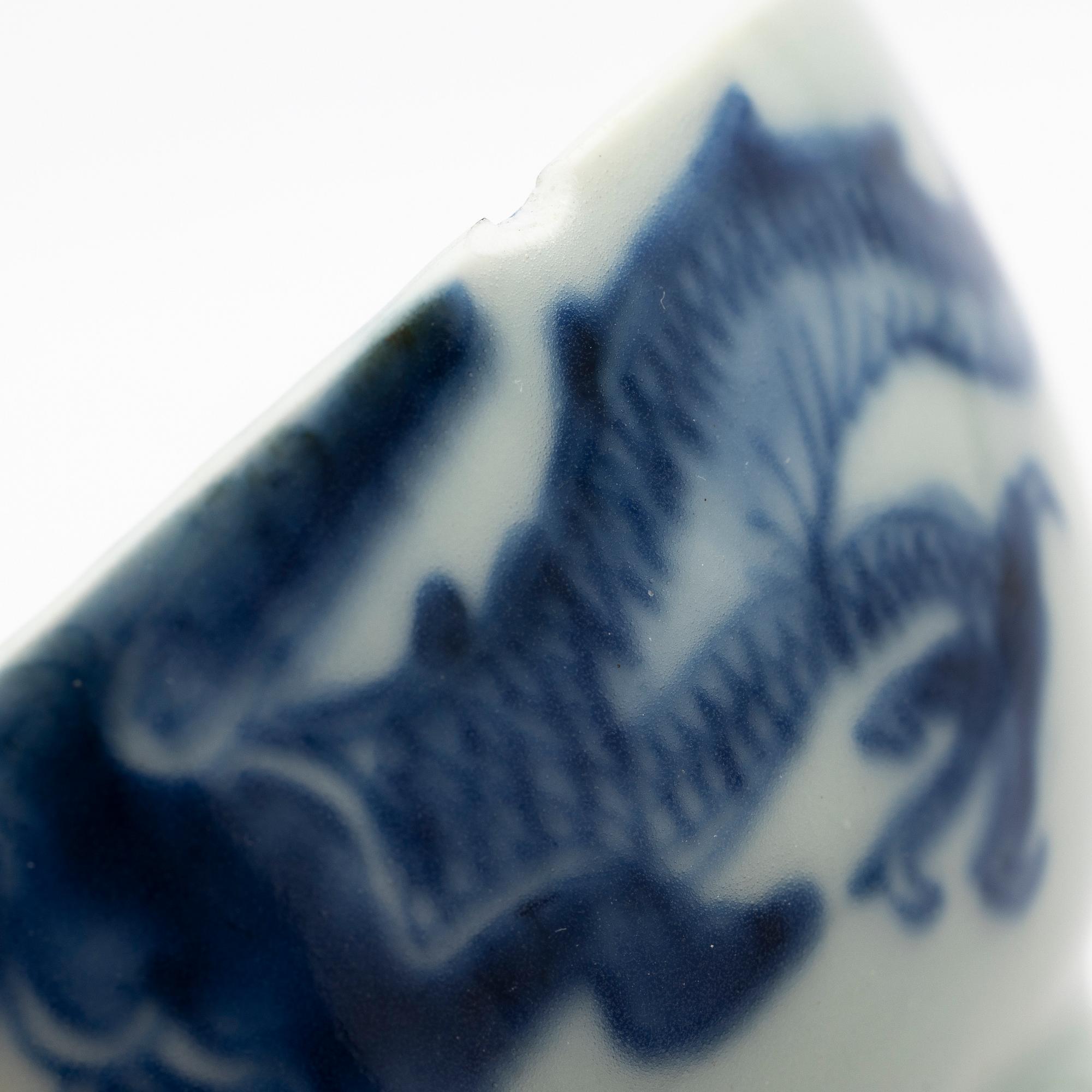 A pair of Chinese blue and white porcelain saucers with stands, Qing dynasty, 19th century.