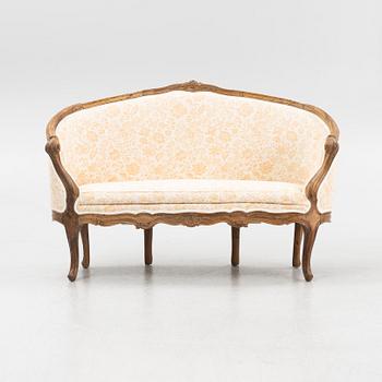 A mahogany Louis XV sofa, France, 18th Century.