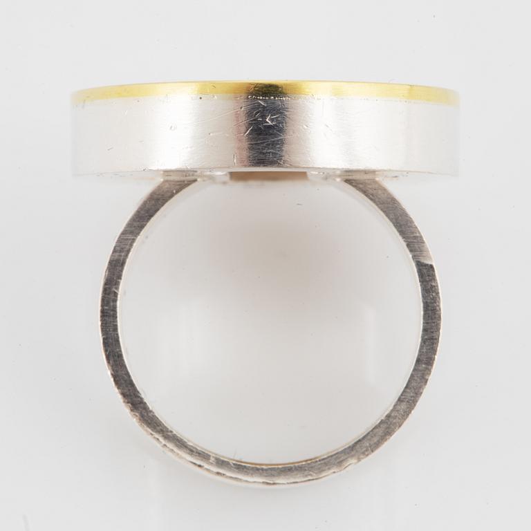 A Hedvig Westermark ring in silver and 18K gold.