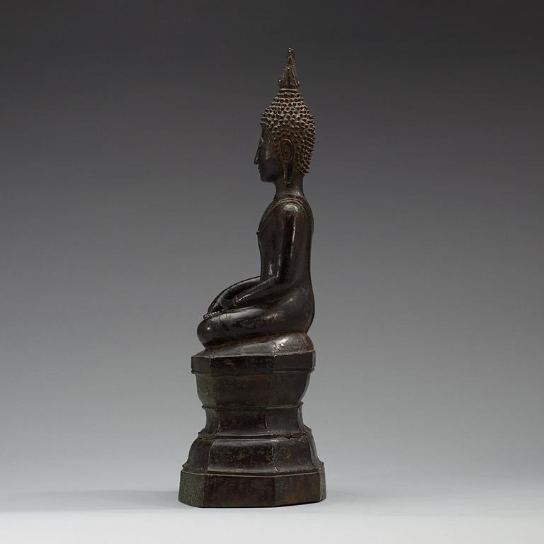 A large seated bronze figure of buddha, Thailand, 19th Century or older. With inscription to base.