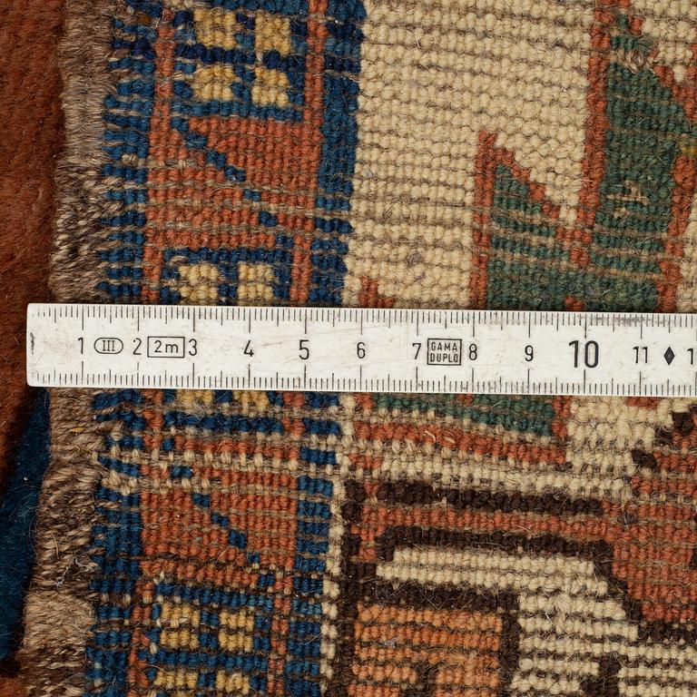 A RUG, a semi-antique Caucasian, ca 175 x 102 cm.