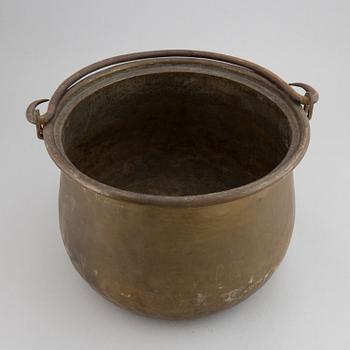 A large 18th century brass cauldron.
