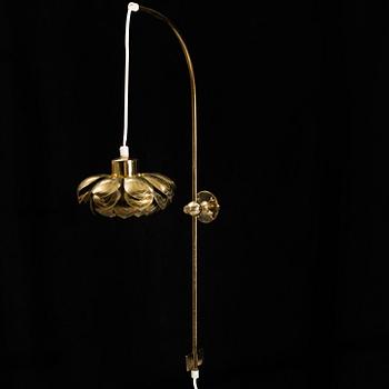 A model 2600 brass wall lamp by Josef Frank for Firma Svenskt Tenn.