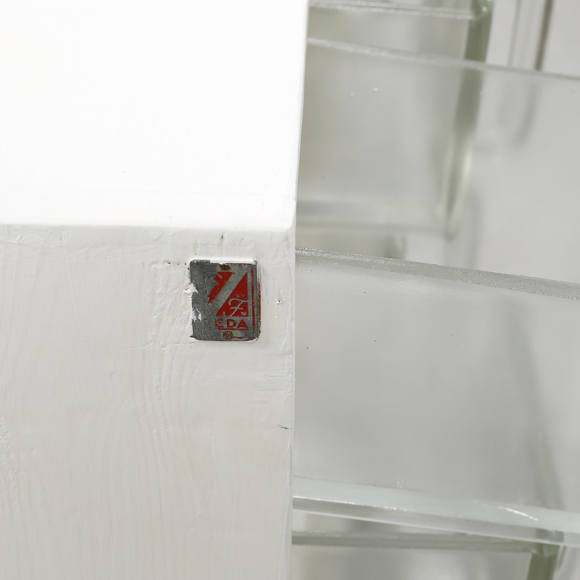 A spice rack from around the middle of the 20th century.