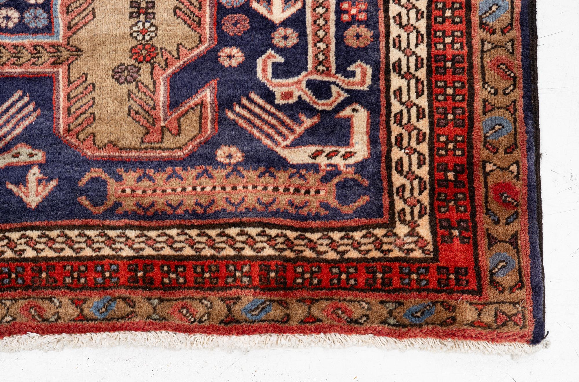 A Sarab carpet, c. 305 x 137 cm.