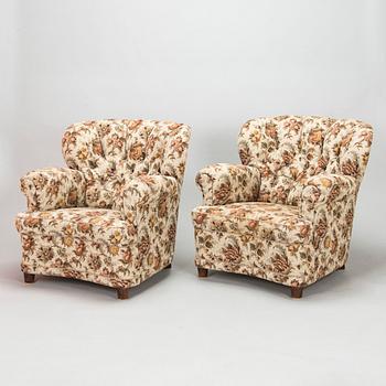 A pair of mid 20th century armchairs.