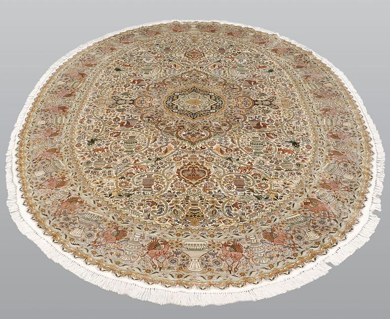 A figural Oriental silk carpet, approx. 273 x 180 cm.