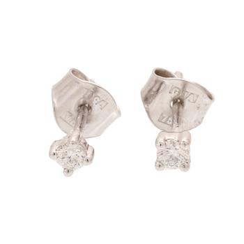 A pair of 18K white gold earrings with round brilliant cut diamonds.