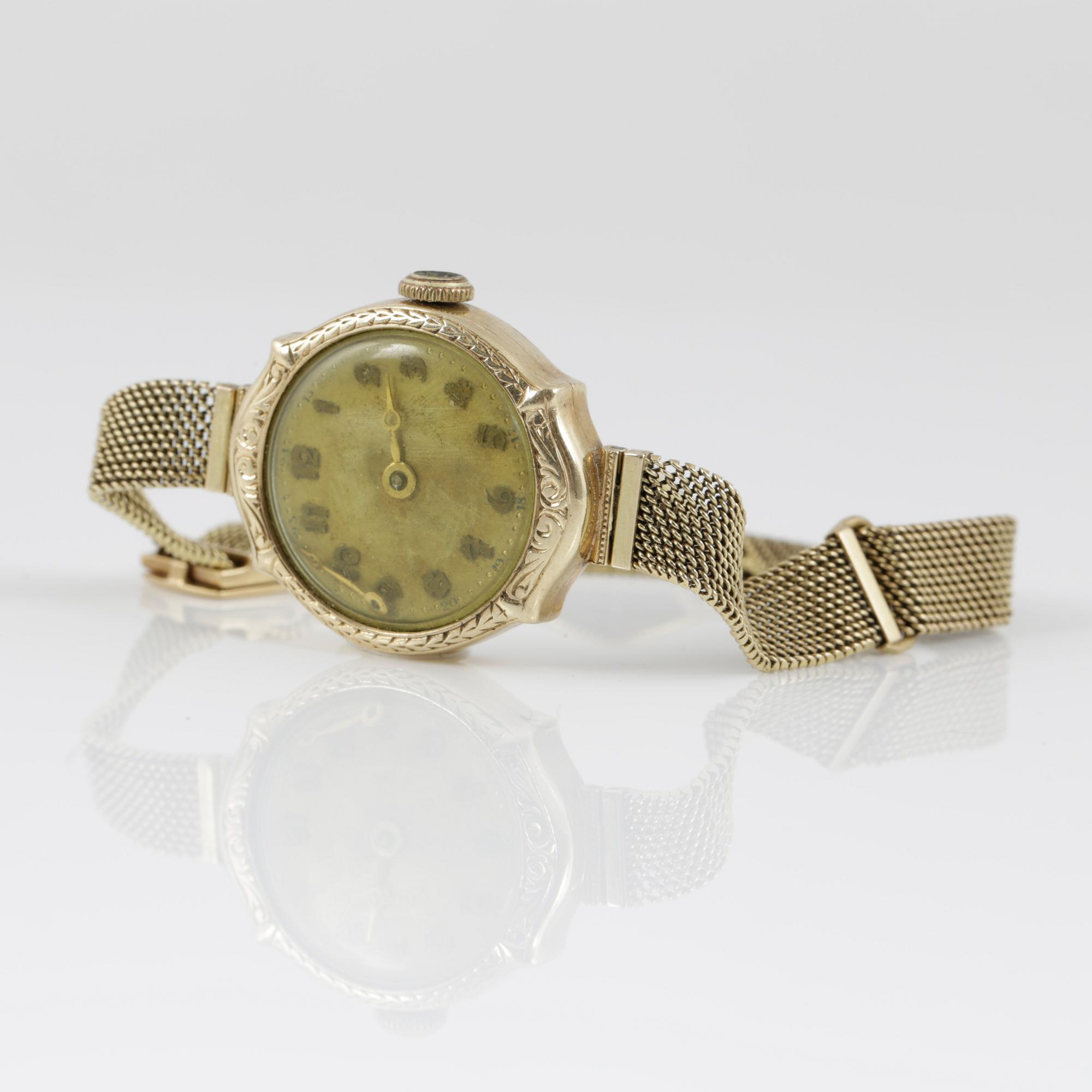 DAMARMBANDSUR SAMT DAMFICKUR, guld 14K, 1900-talets första hälft. Tot ca 38 gram.
