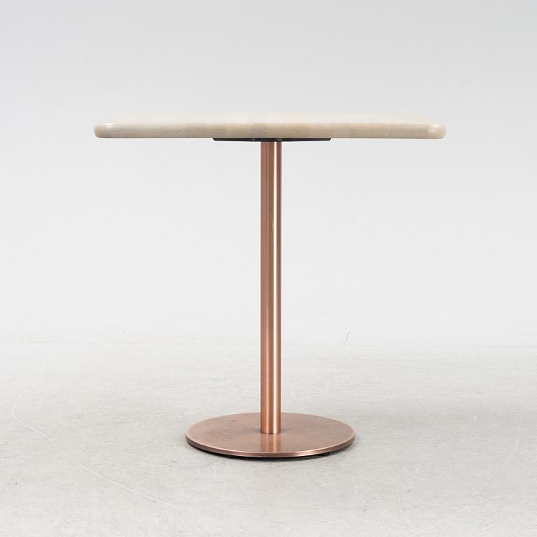 A steel and oak table by Jonas Lindvall 2011.