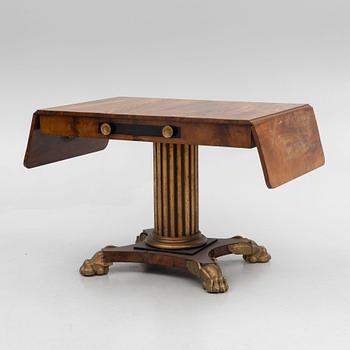 An Empire table, first half of the 19th Century.