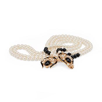 OSCAR DE LA RENTA, a decorative pearl necklace in black and white.