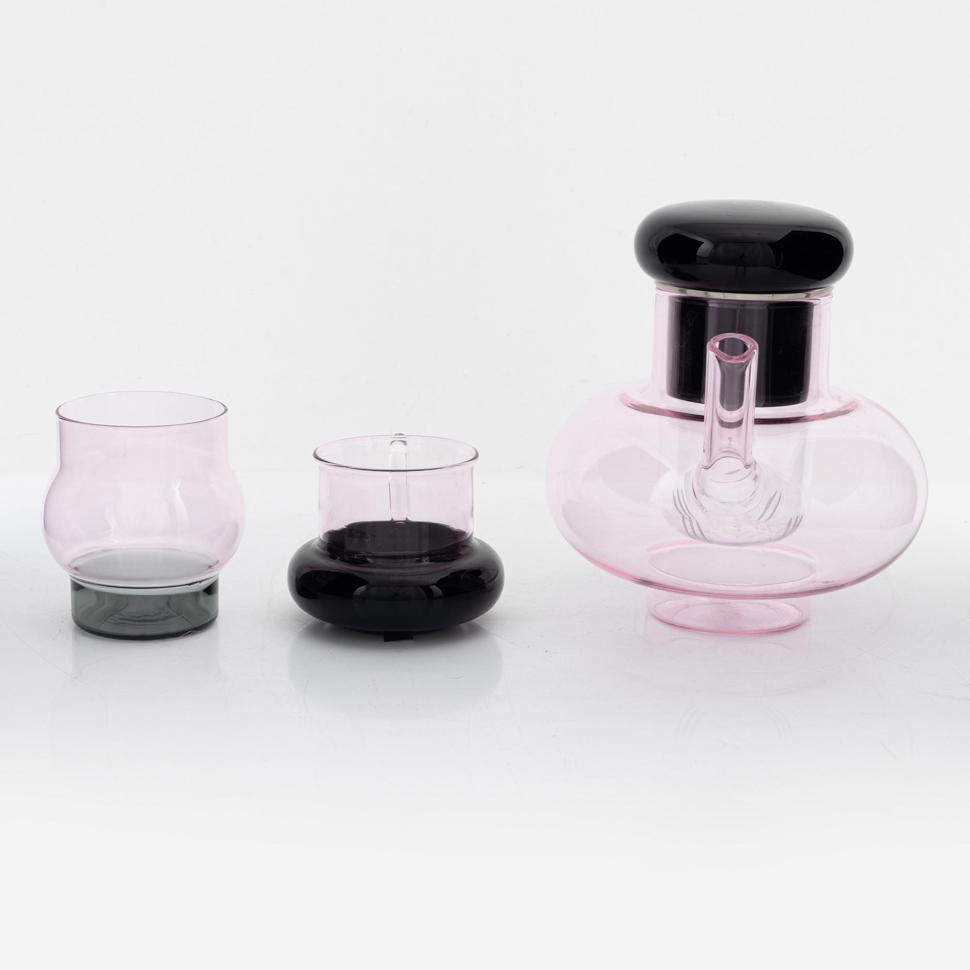Tom Dixon, A 'Bump' glass teapot with for cups and a pair of glasses.