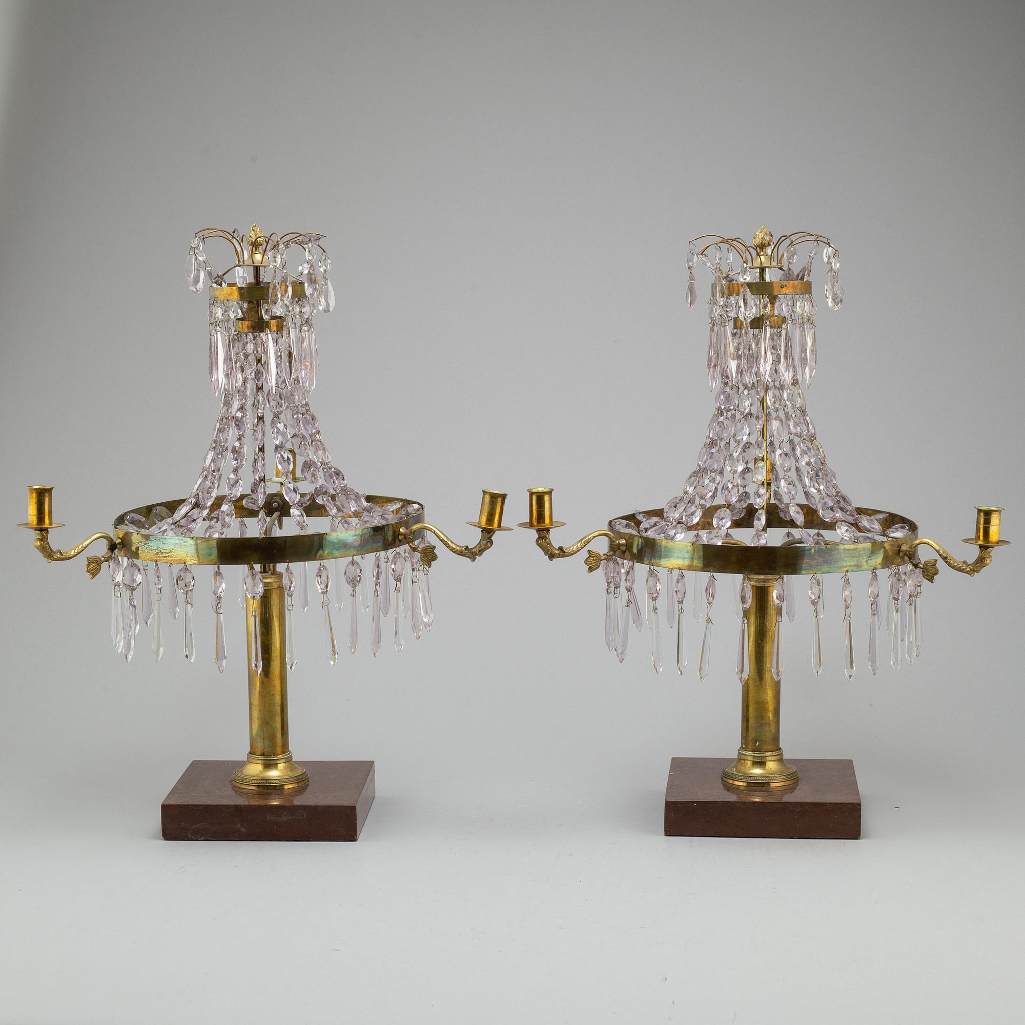A pair of late Gustavian style three-light candelabra.