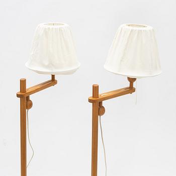 Yngve Ekström, a pair of pinewood  'Lystella' floor lights, Swedese.