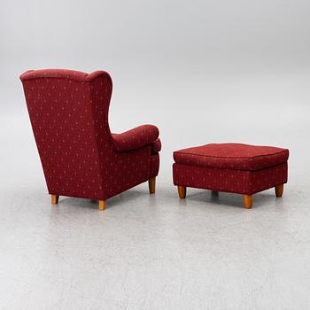 Carl Malmsten, a 'Häggbom' armchair with a 'Jättepaddan' ottoman, AB OH Sjögren, Tranås.